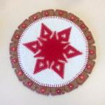 June Griepp's Snowflake topper with red buttons